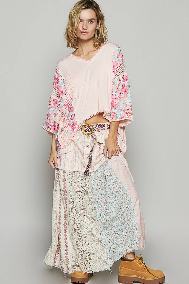 V-neck drop shoulder print fabric contrast knit top.