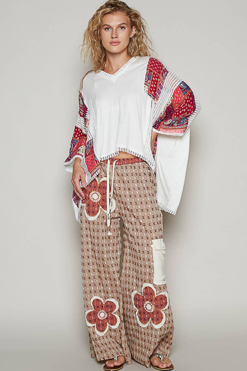 V-neck drop shoulder print fabric contrast knit top.