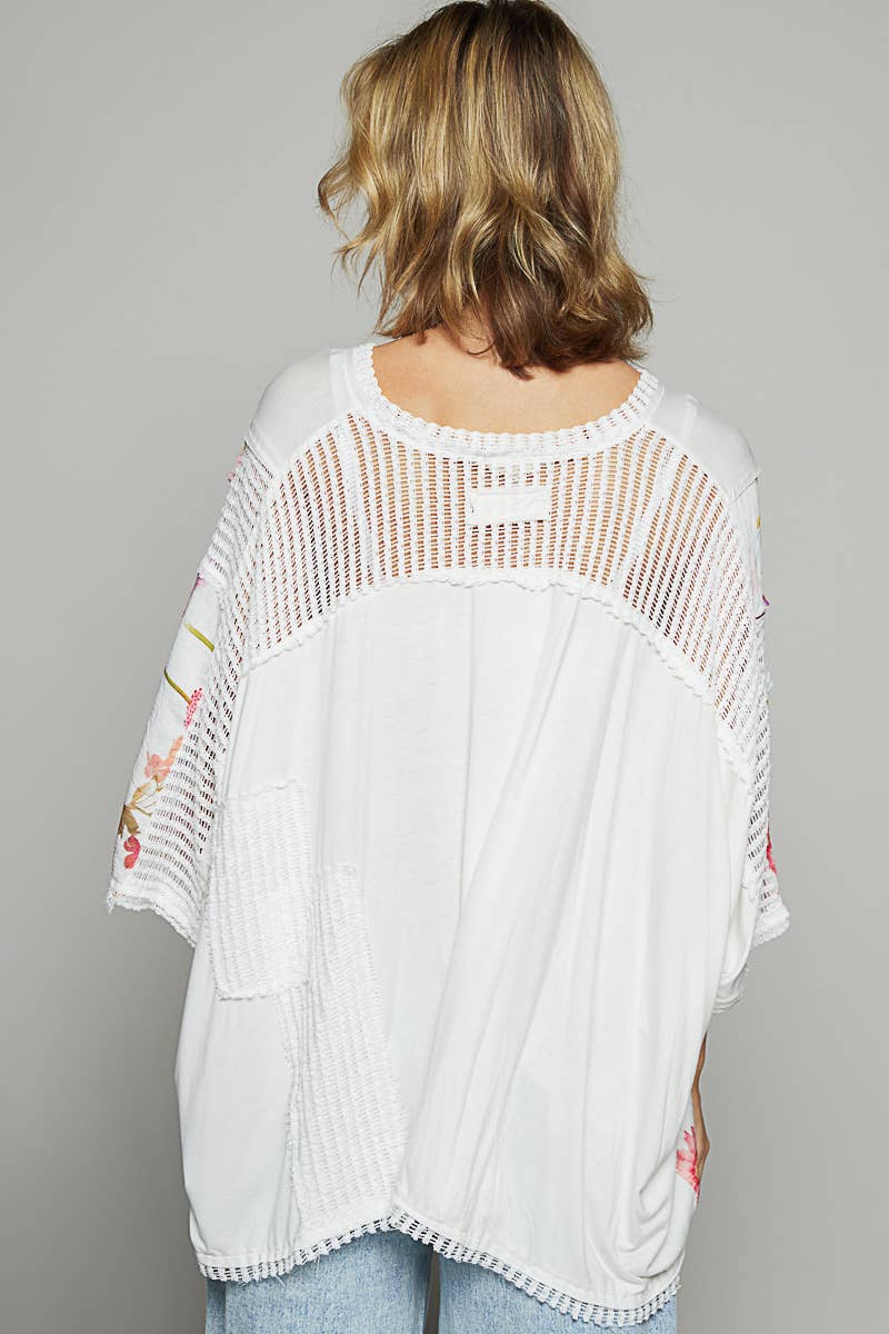V-neck drop shoulder print fabric contrast knit top.