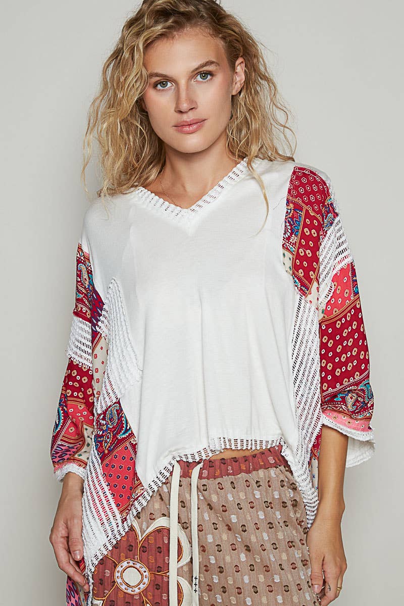 V-neck drop shoulder print fabric contrast knit top.