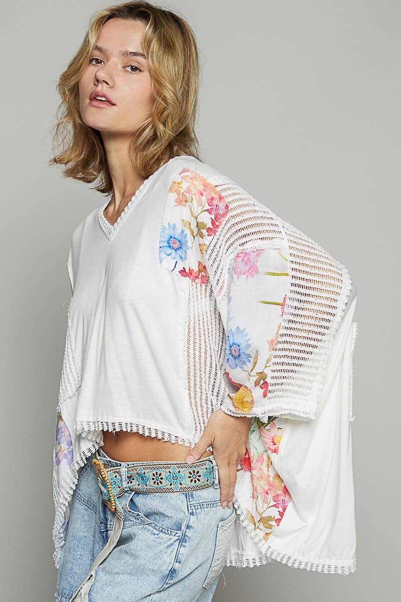 V-neck drop shoulder print fabric contrast knit top.
