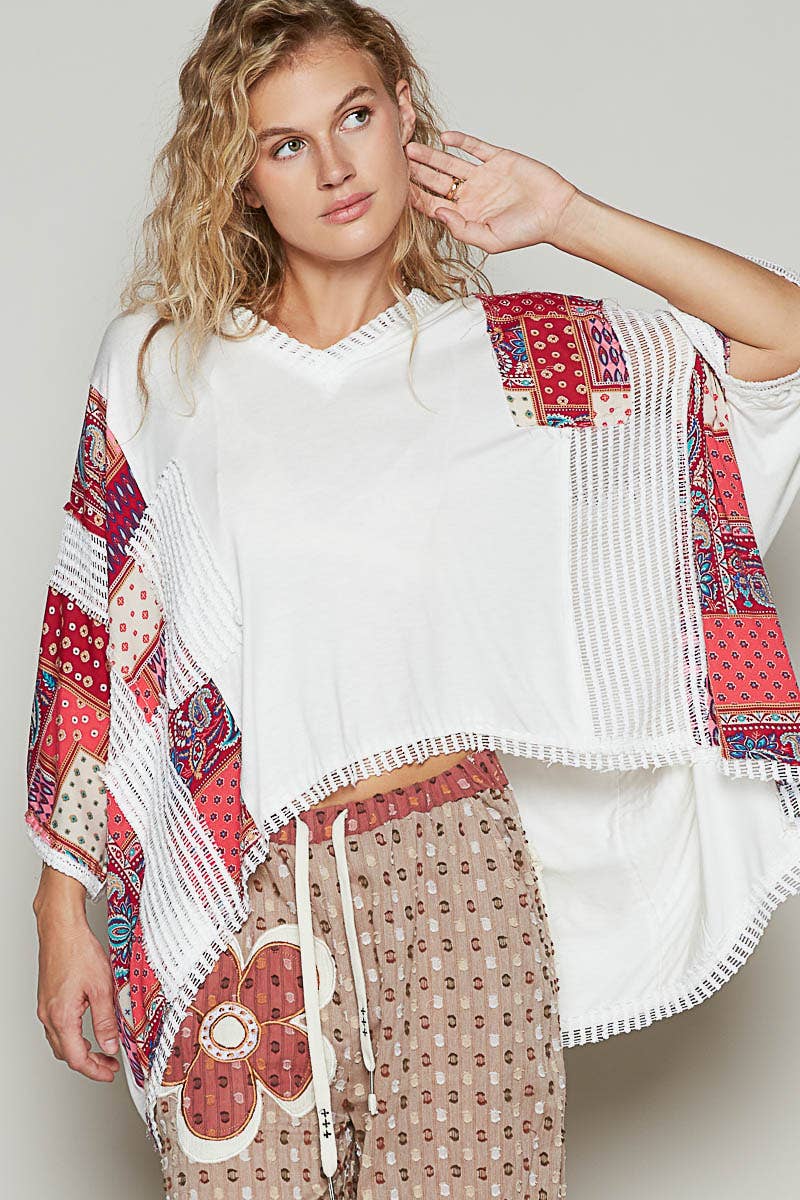 V-neck drop shoulder print fabric contrast knit top.