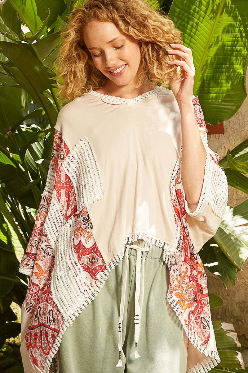 V-neck drop shoulder print fabric contrast knit top.