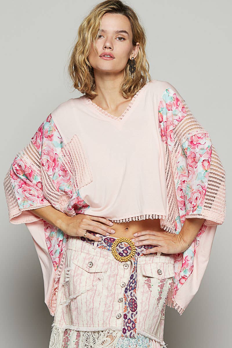 V-neck drop shoulder print fabric contrast knit top.