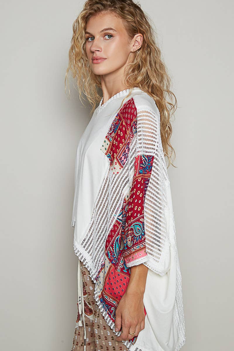V-neck drop shoulder print fabric contrast knit top.